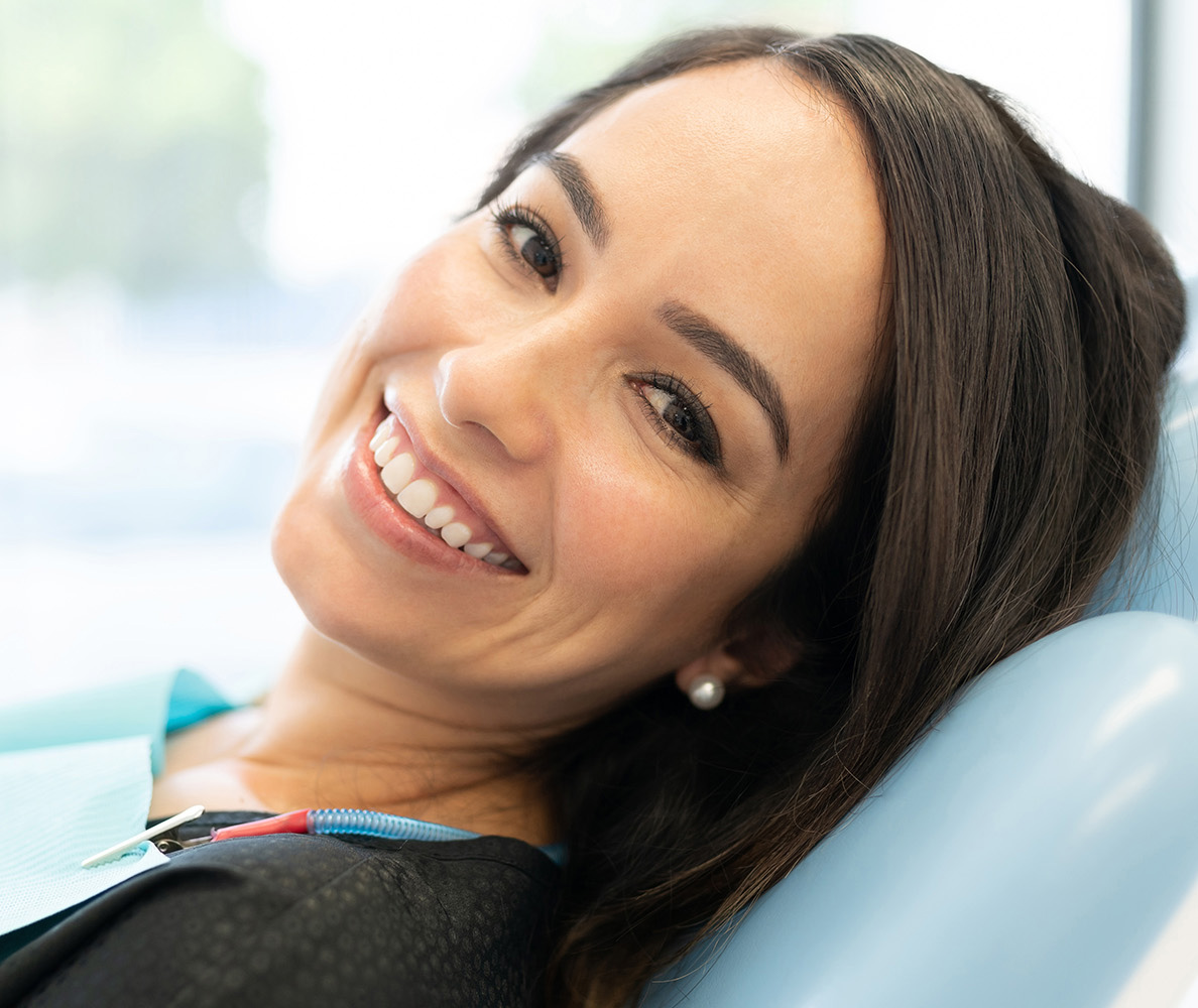 Patient smiling after a successful dental emergency consultation