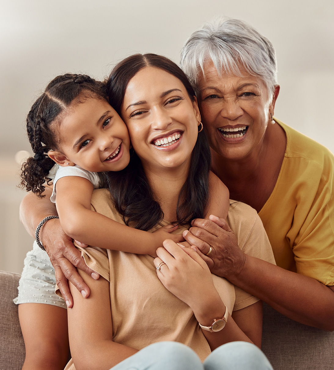 Grandmother, mom and child hug Family smiling after dental consult