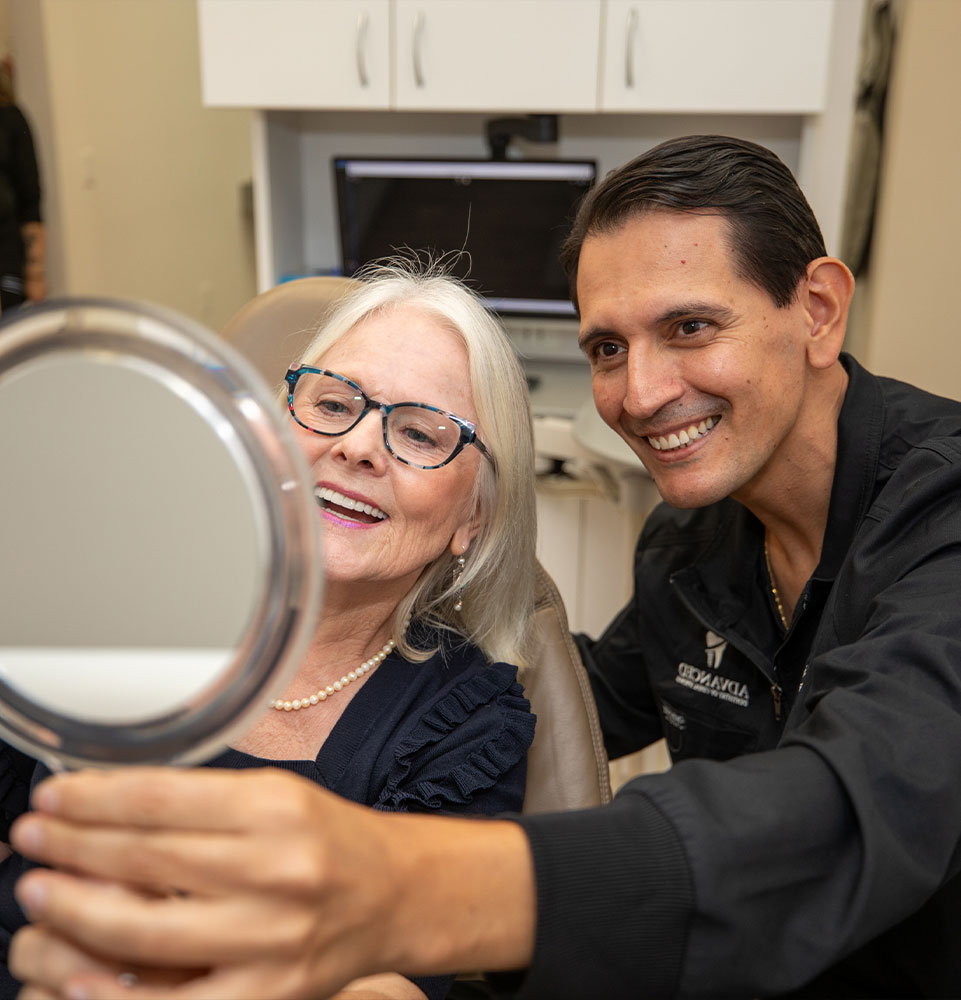 patient and doctor smiling after patient's procedure